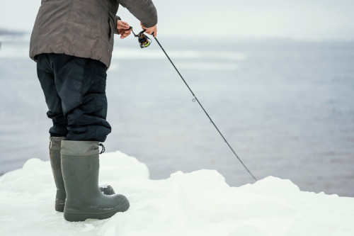 An angler is using a jerkbait to fish for winter bass.